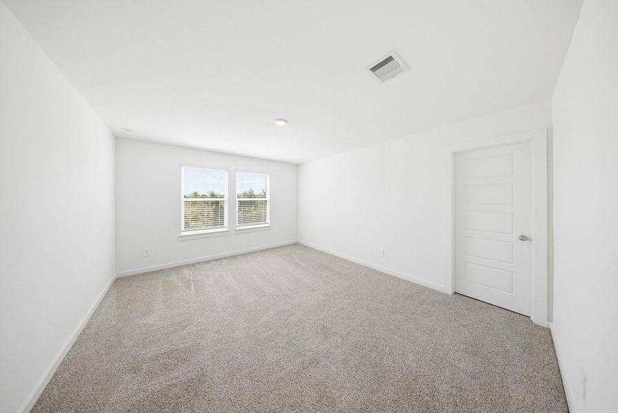 Spacious primary bedroom