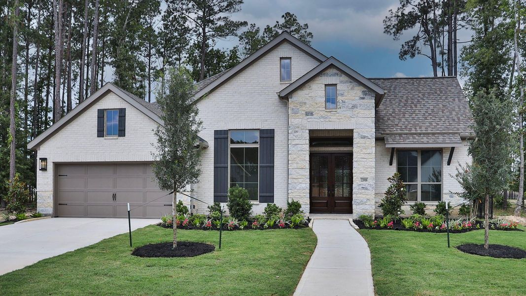 Front exterior of a new home in The Highlands, Porter, TX, highlighting curb appeal (Image 1). Front exterior of a new home in The Highlands, Porter, TX, highlighting curb appeal (Image 1).