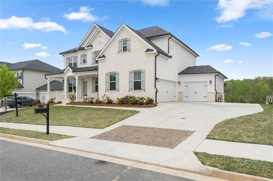 Front exterior of a new home in , Canton, GA, highlighting curb appeal (Image 2). Front exterior of a new home in , Canton, GA, highlighting curb appeal (Image 2).