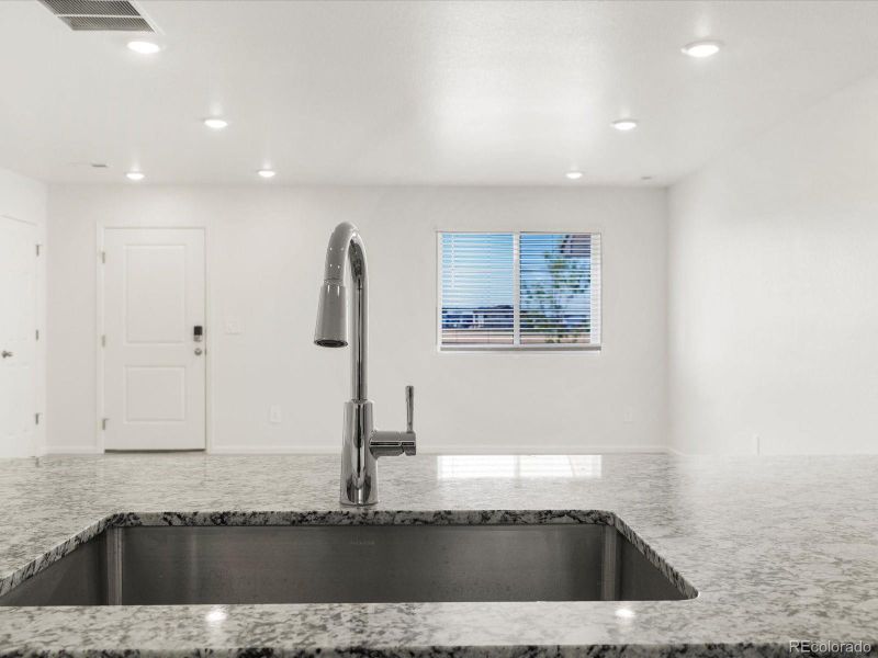 Furnished interior view inside a new home in Skyview at High Point, Aurora (Image 11).