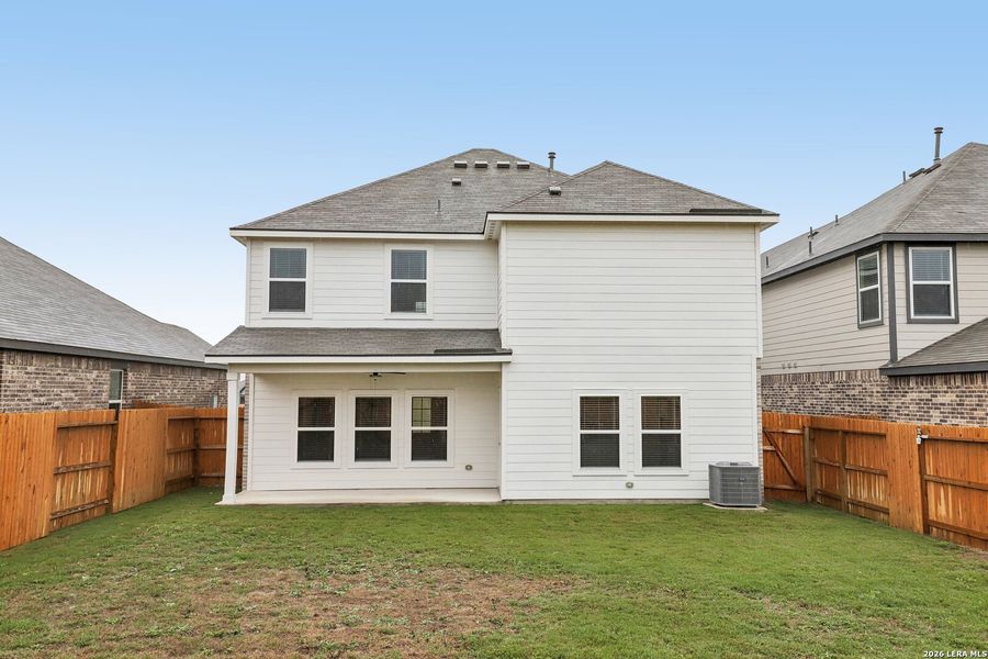 Exterior details and patio area of a home in Hightop Ridge, Converse (Image 24).