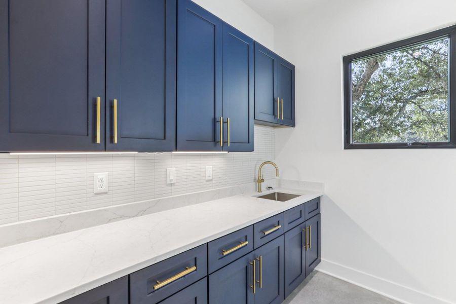 Designed for convenience, this dedicated laundry closet features full-size hookups and an overhead shelf for storage, keeping your essentials organized and out of sight