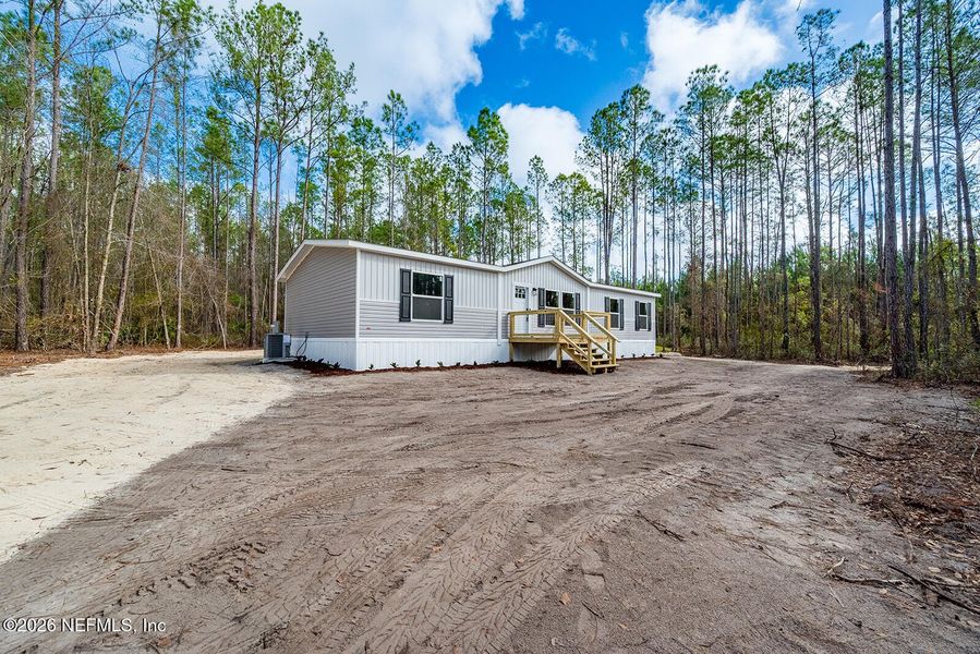 Exterior details and patio area of a home in , Lake Butler (Image 19).