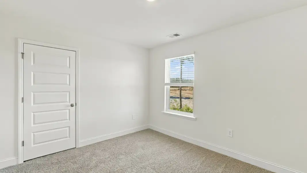 Spacious, unfurnished interior of a new home in The Lakes at North Glynn, Brunswick (Image 22).