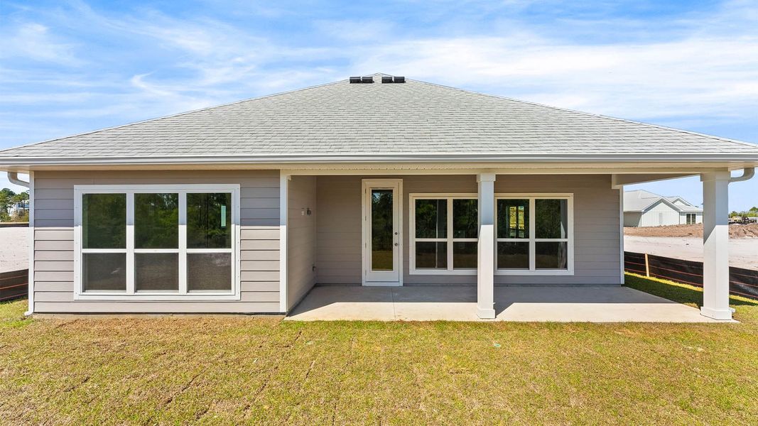 Exterior details and patio area of a home in WindMark Beach, Port Saint Joe (Image 4).