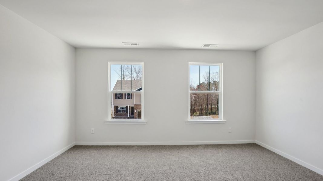 Spacious, unfurnished interior of a new home in Tap Root Farms, Fletcher (Image 13).