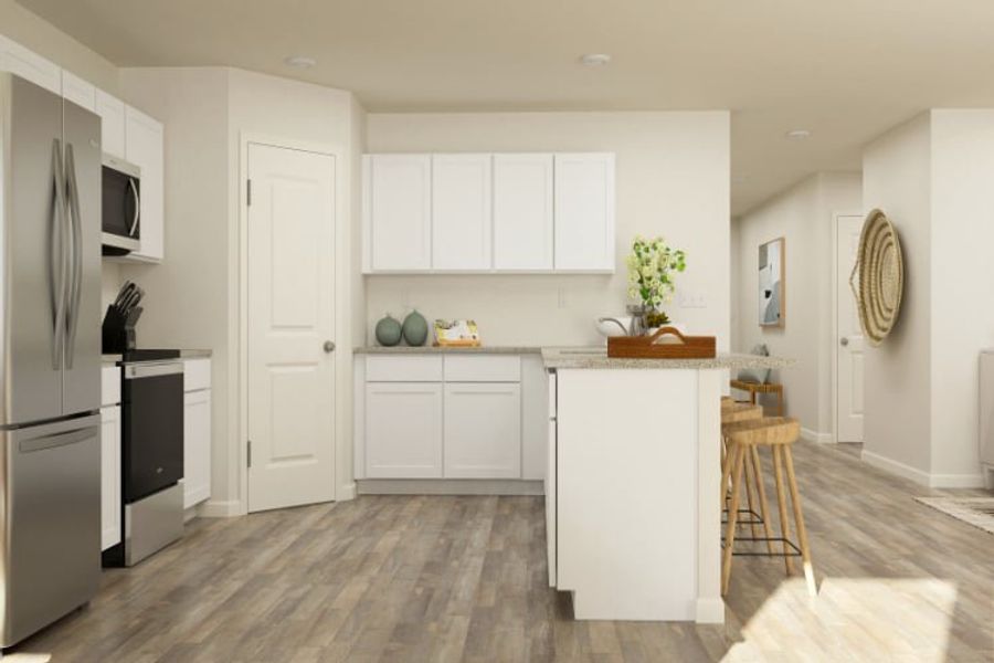 A kitchen with white cabinets. A kitchen with white cabinets.