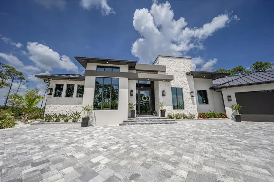 Front exterior of a new home in , Venice, FL, highlighting curb appeal (Image 25). Front exterior of a new home in , Venice, FL, highlighting curb appeal (Image 25).