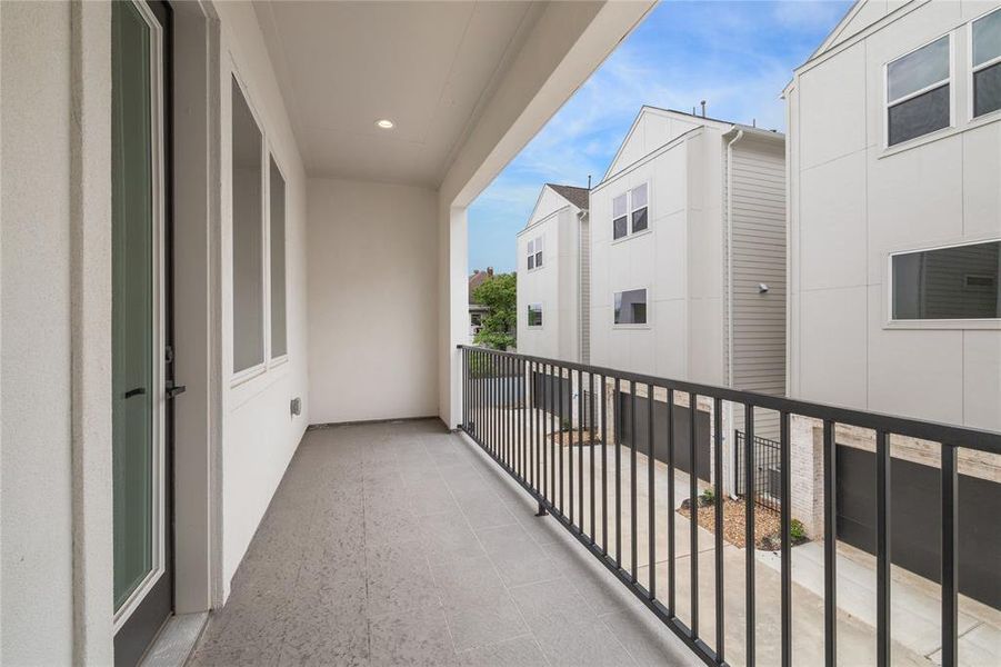 Step out onto the private balcony, directly accessible from the living room on the second floor.