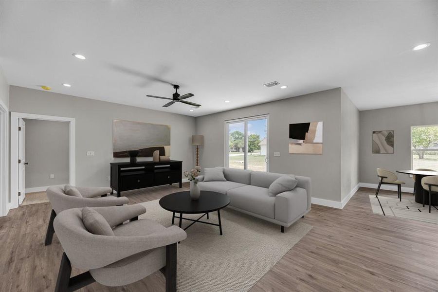 Living area featuring light wood-style floors, recessed lighting, plenty of natural light, and a ceiling fan