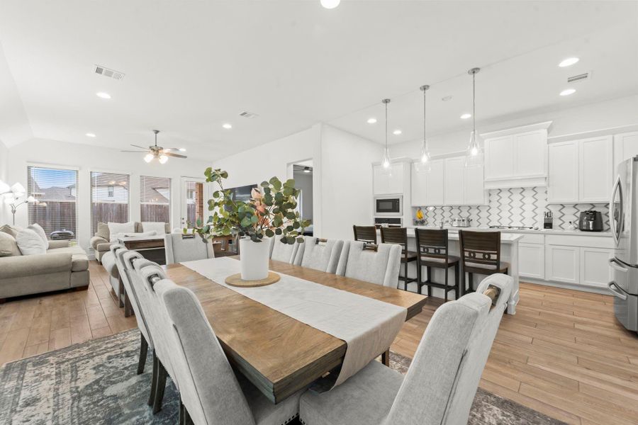 This gorgeous living and kitchen area is an entertainer’s dream! With an open floor plan, conversation flows effortlessly between the kitchen, dining, and living room—perfect for hosting or enjoying time with loved ones.