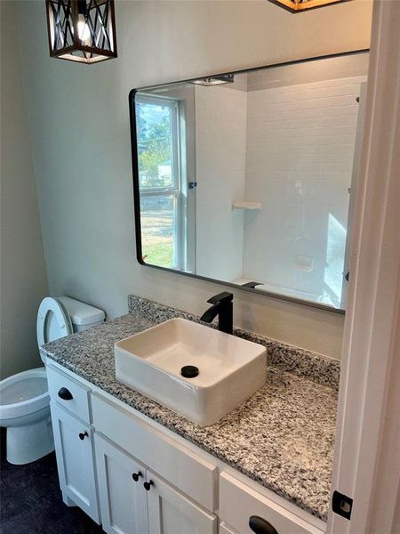 Bathroom with vanity and toilet