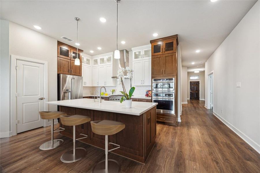 Kitchen featuring an island with a breakfast area.