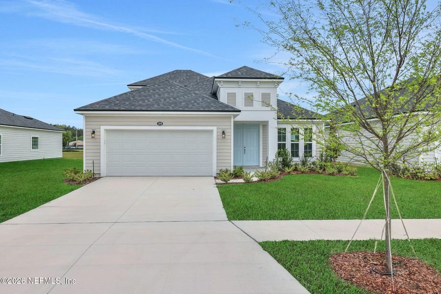 Front exterior of a new home in Amberly, Green Cove Springs, FL, highlighting curb appeal (Image 22).