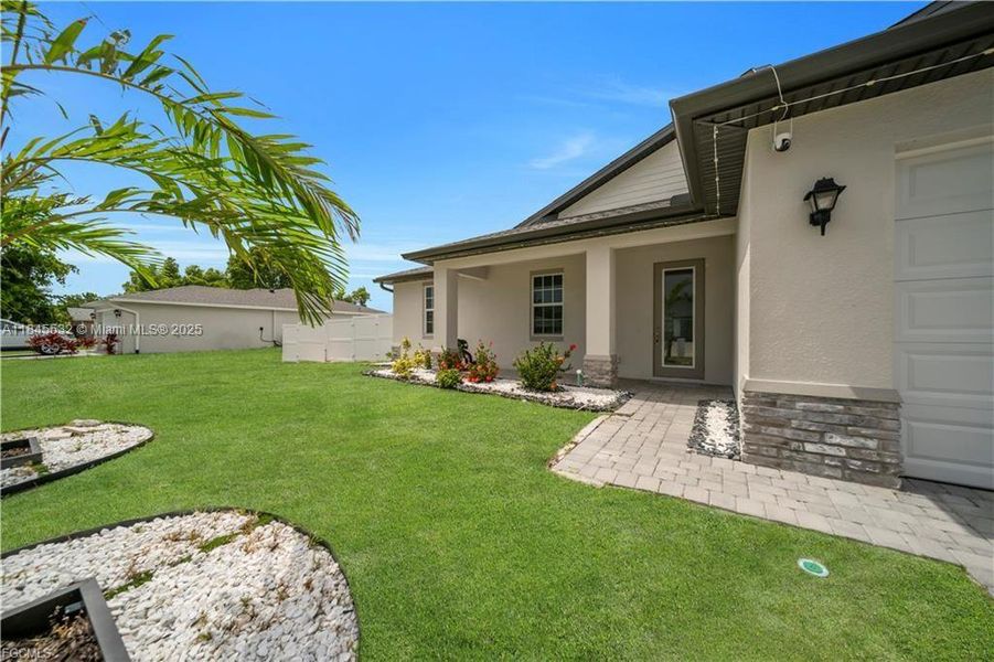 Front exterior of a new home in , Cape Coral, FL, highlighting curb appeal (Image 20). Front exterior of a new home in , Cape Coral, FL, highlighting curb appeal (Image 20).