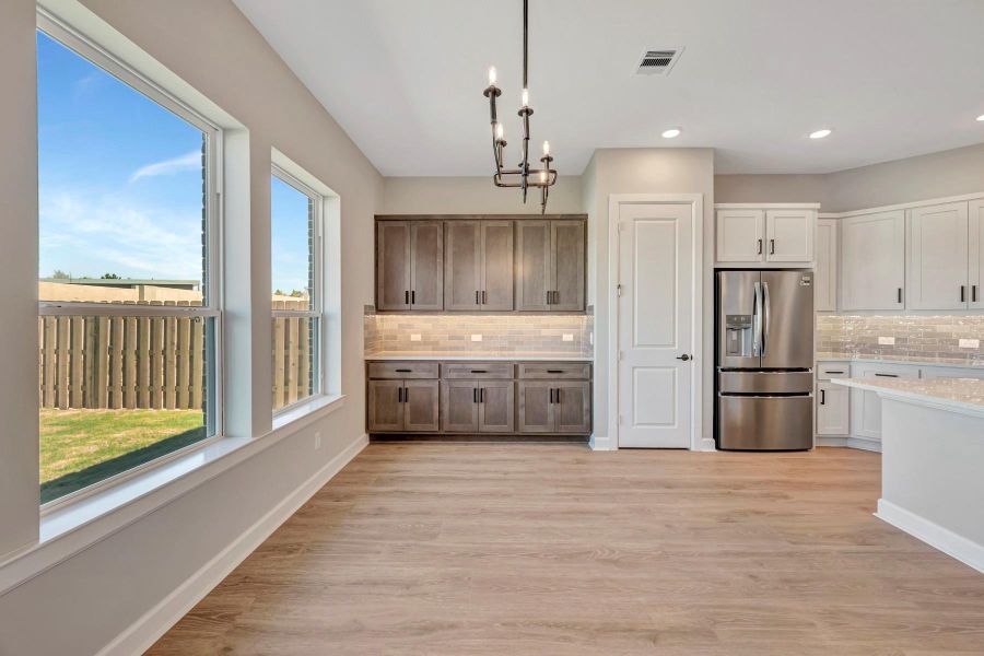 Furnished interior view inside a new home in COLTON - Reserve Collection, Todd Mission (Image 20).