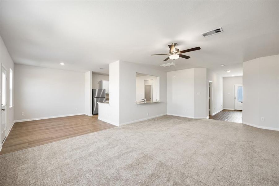 Spacious living room, open to the kitchen and dining area.