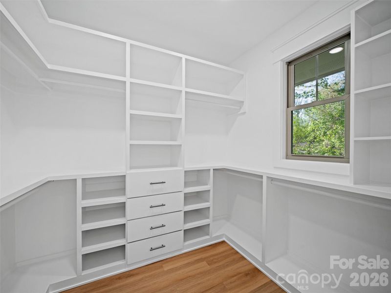 Walk in closet with built in features.