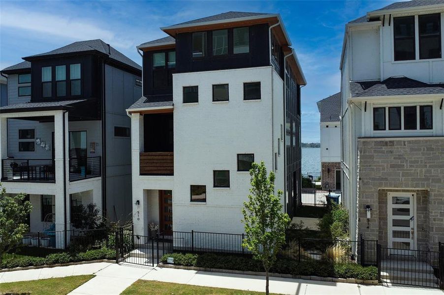 Front exterior of a new home in , Rowlett, TX, highlighting curb appeal (Image 20).