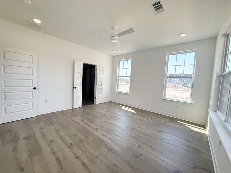 Unfurnished bedroom with ceiling fan, dark wood finished floors, and recessed lighting