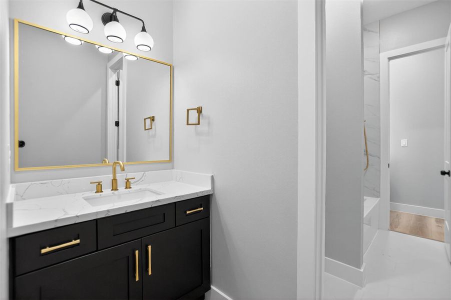 The private vanity with sink for secondary bedroom 1