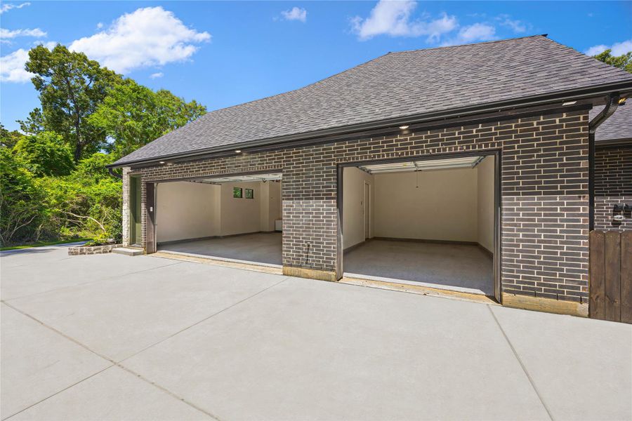 Spacious 3-car garage featuring professionally finished epoxy flooring for a clean, durable, and high-end look. Spacious 3-car garage featuring professionally finished epoxy flooring for a clean, durable, and high-end look.