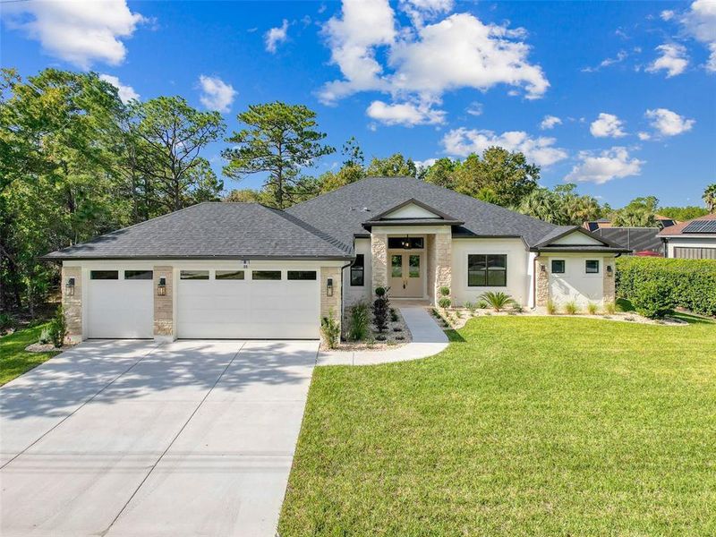 Front exterior of a new home in , Homosassa, FL, highlighting curb appeal (Image 34). Front exterior of a new home in , Homosassa, FL, highlighting curb appeal (Image 34).