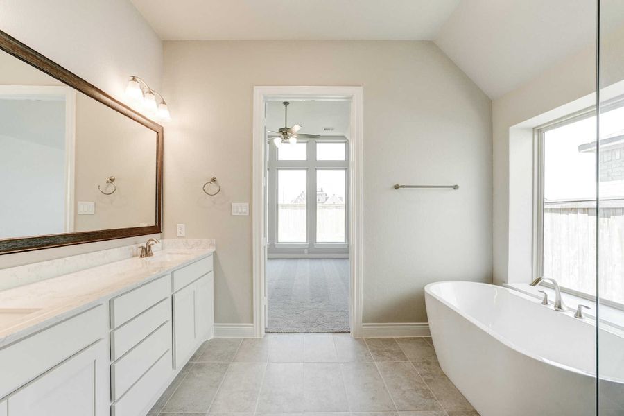 Representative furnished interior of a home built from the 2688 by Ravenna Homes in The Woodlands Hills 65′, Willis (Image 10).