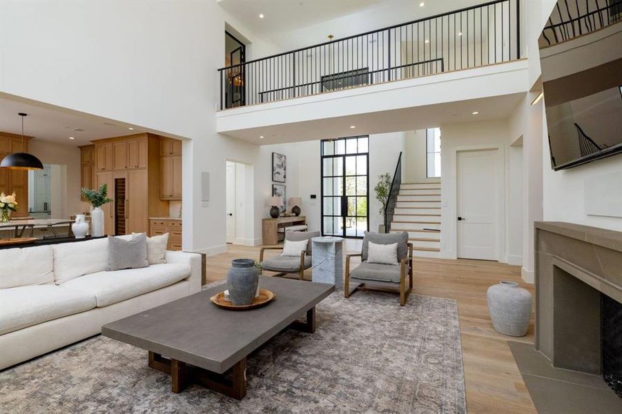 Upstairs lead to a catwalk with a gym, 3 bedrooms with en-suite, a loft and laundry room!