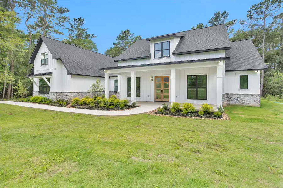 Front exterior of a new home in , Plantersville, TX, highlighting curb appeal (Image 21).