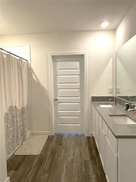 Master Bath with dual sinks, walk in closet and additional large linen closet