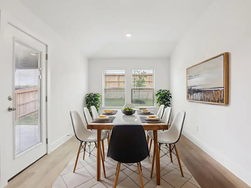 Dining in the Callaghan floorplan at a Meritage Homes community.