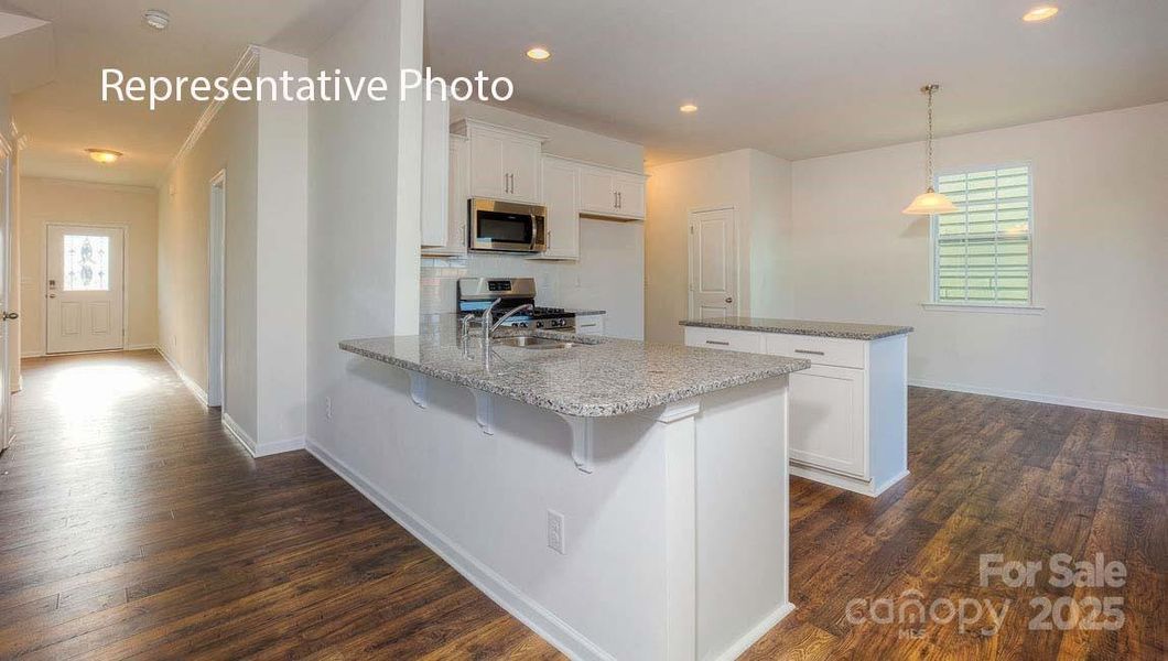 Furnished interior view inside a new home in Secrest Commons, Monroe (Image 1).