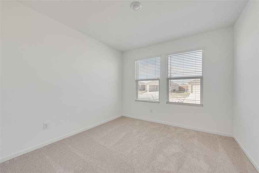 Unfurnished room featuring light colored carpet