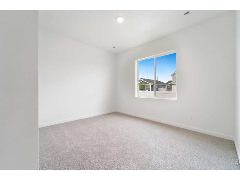 Spacious, unfurnished interior of a new home in Union Colony West, Greeley (Image 12).