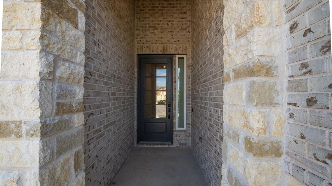 Doorway to property with stone siding Doorway to property with stone siding