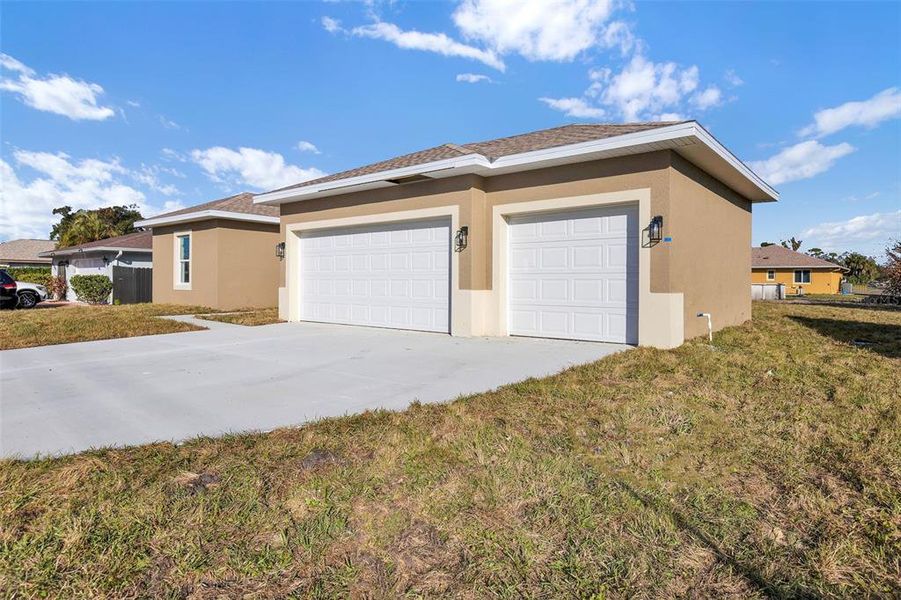 Front exterior of a new home in , Port Charlotte, FL, highlighting curb appeal (Image 1). Front exterior of a new home in , Port Charlotte, FL, highlighting curb appeal (Image 1).