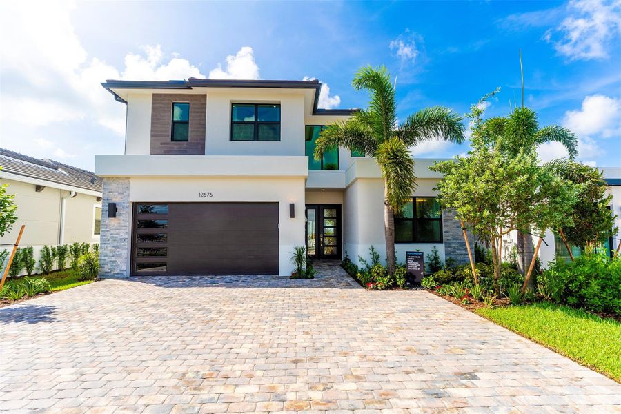 Front exterior of a new home in , Palm Beach Gardens, FL, highlighting curb appeal (Image 22).