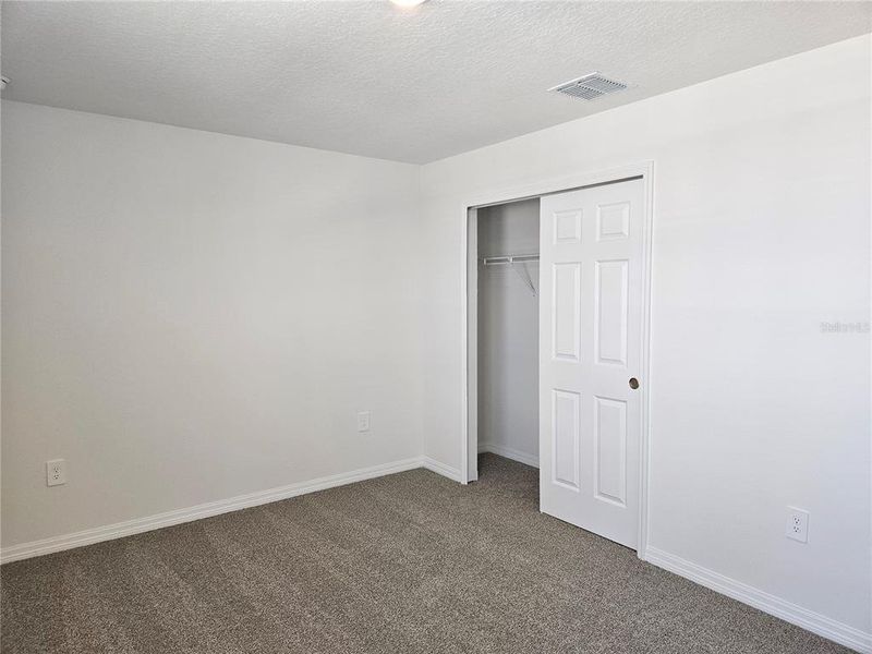 Spacious, unfurnished interior of a new home in Lawson Dunes - Signature Series, Haines City (Image 32).