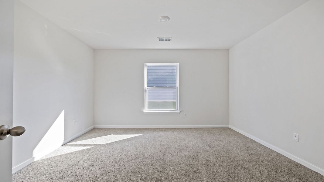 Spacious, unfurnished interior of a new home in Bentley Park, Greenwood (Image 21).