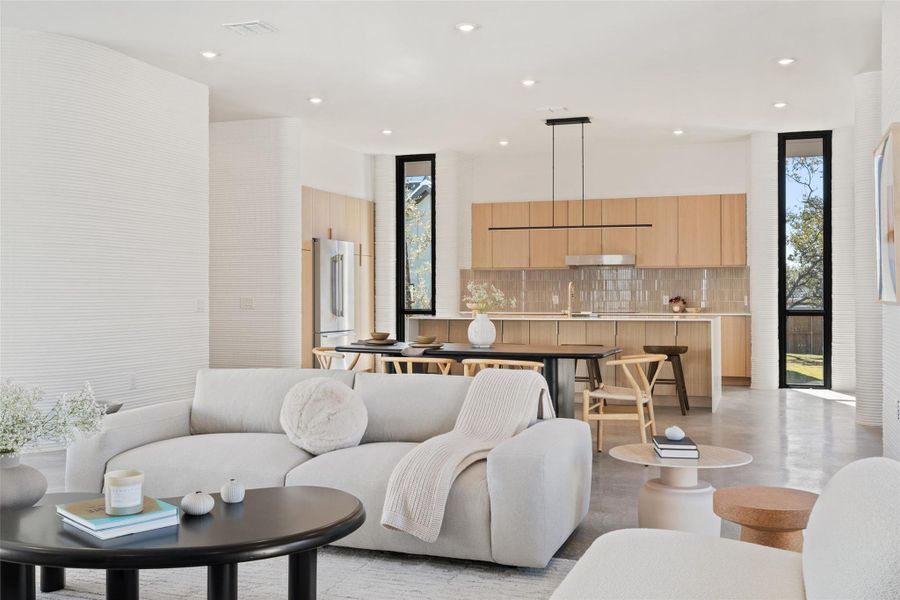 Living room featuring expansive windows and sink