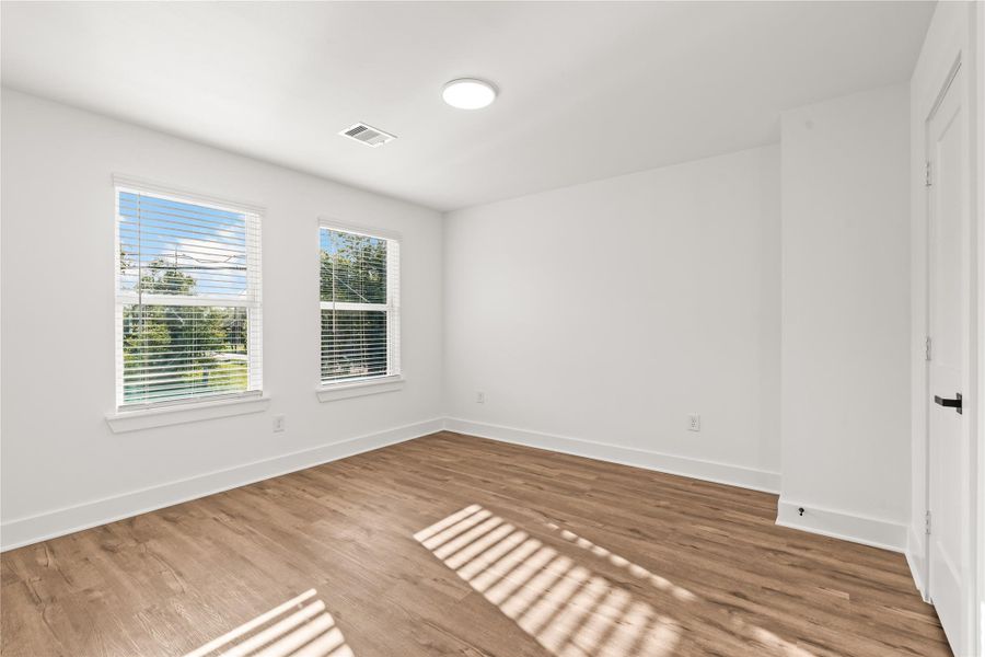 Seamless layout flow. The strategic placement of outlets and windows makes arranging full-sized bedroom furniture entirely effortless.