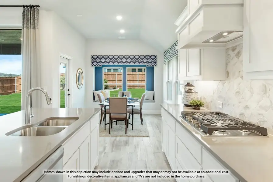 Kitchen with white cabinets, quartz counters, gas cooktop, and dining nook with backyard views. Kitchen with white cabinets, quartz counters, gas cooktop, and dining nook with backyard views.