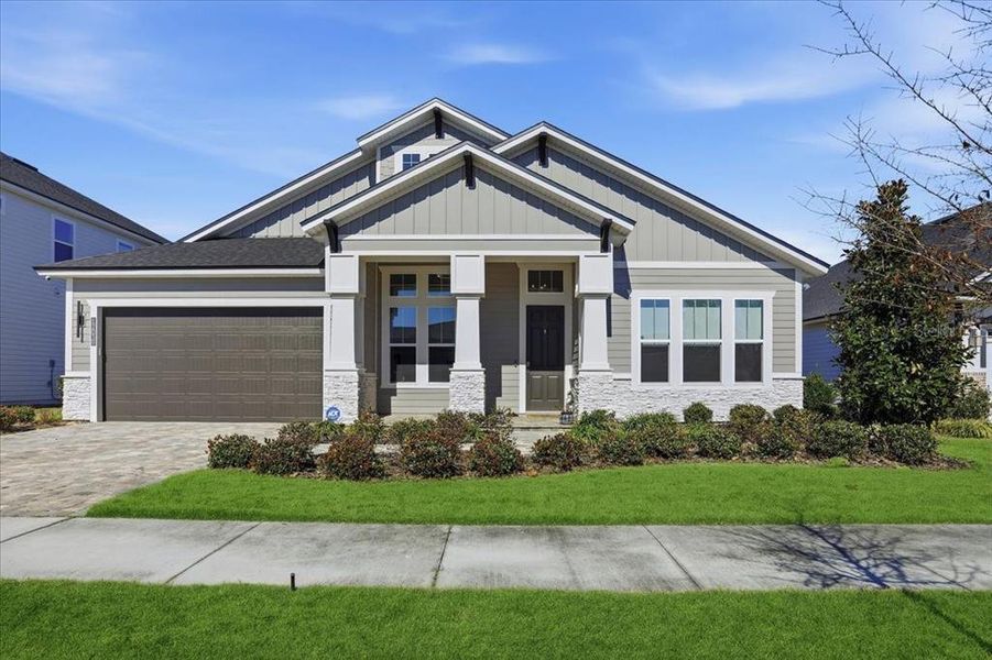 Front exterior of a new home in Oakmont, Gainesville, FL, highlighting curb appeal (Image 1). Front exterior of a new home in Oakmont, Gainesville, FL, highlighting curb appeal (Image 1).