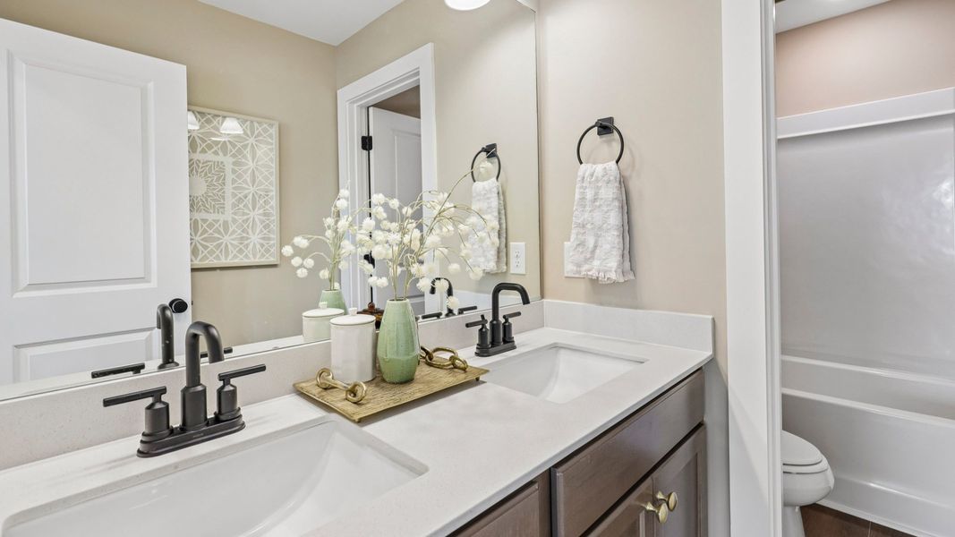Secondary bathroom with dual vanity Secondary bathroom with dual vanity