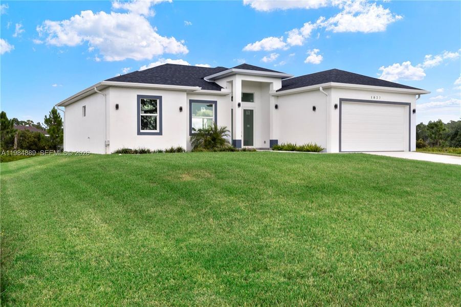 Front exterior of a new home in , Lehigh Acres, FL, highlighting curb appeal (Image 27).