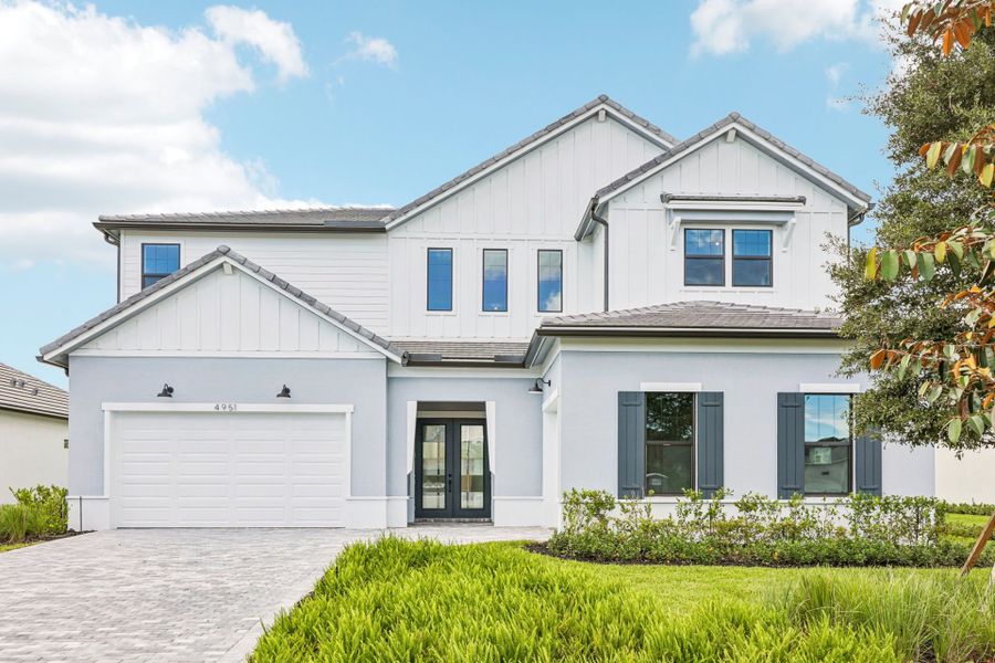 Front exterior of a new home in Marigold, Davie, FL, highlighting curb appeal (Image 25). Front exterior of a new home in Marigold, Davie, FL, highlighting curb appeal (Image 25).