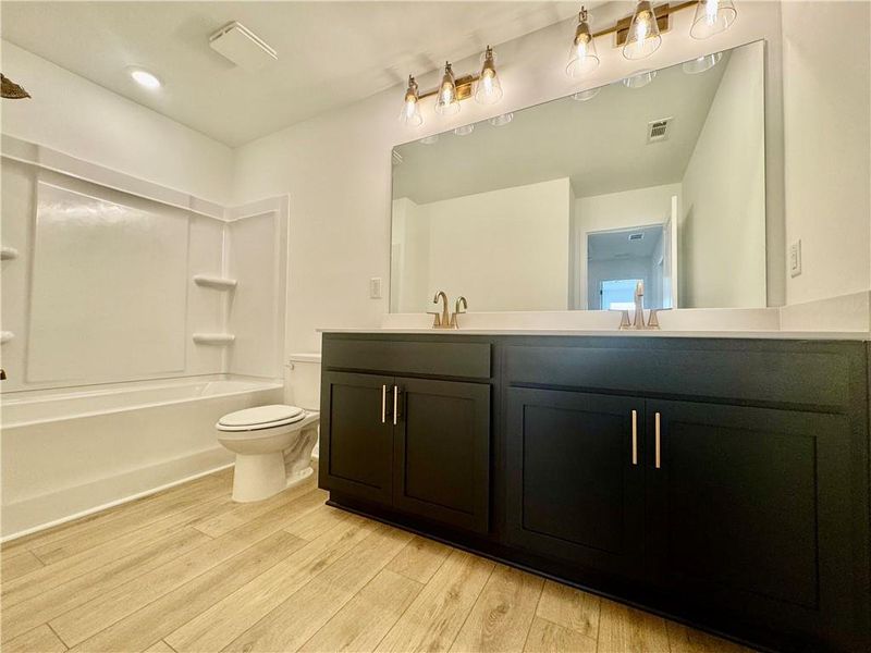 Furnished interior view inside a new home in Eastlyn Crossing, Flowery Branch (Image 12).