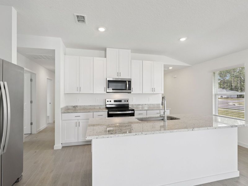 Furnished interior view inside a new home in Lakes at Bella Lago - Classic Series, Green Cove Springs (Image 3).