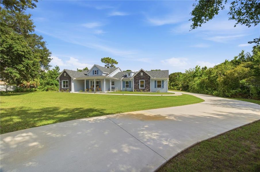 Front exterior of a new home in , Wesley Chapel, FL, highlighting curb appeal (Image 31). Front exterior of a new home in , Wesley Chapel, FL, highlighting curb appeal (Image 31).